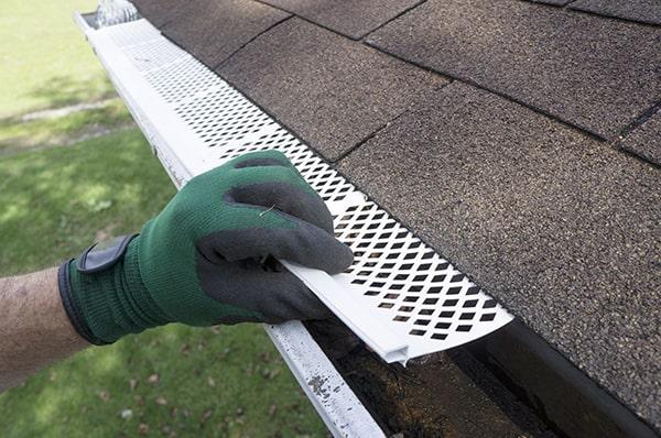 gutter guards prevent clogs and overflow, protecting the roofing and drainage system from water damage and deterioration